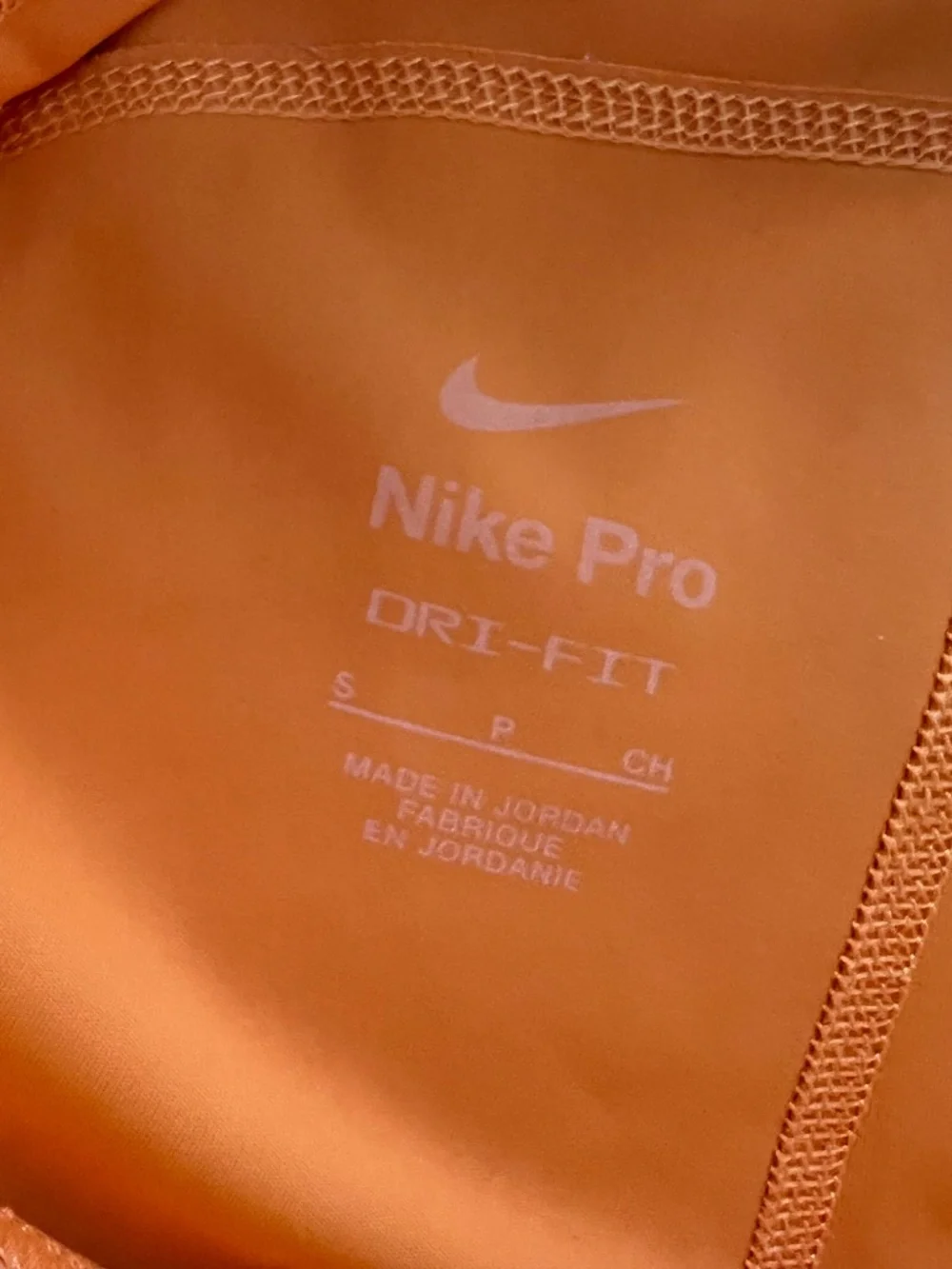 Orange Nike Pro shorts